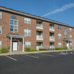 Photo of the front of the building at the Towne Park apartments in Troy, Ohio.
