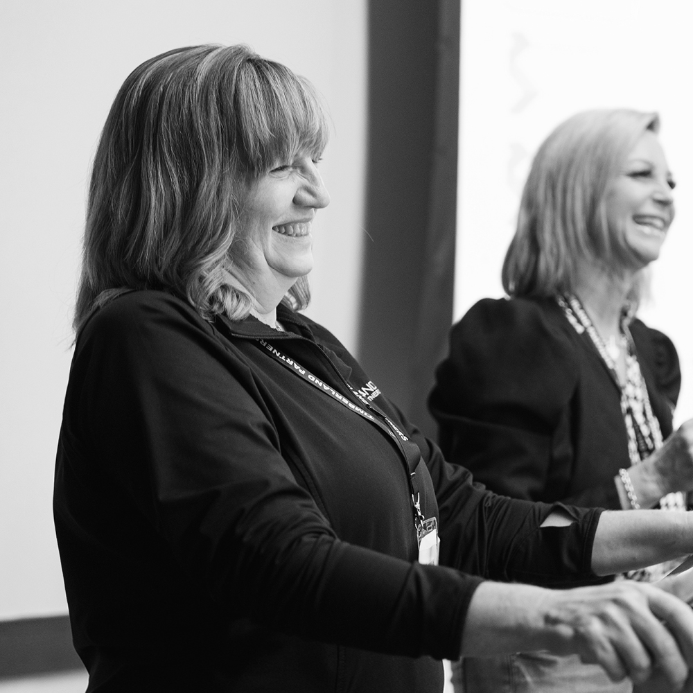 Black and white photo of Pam Brown smiling.