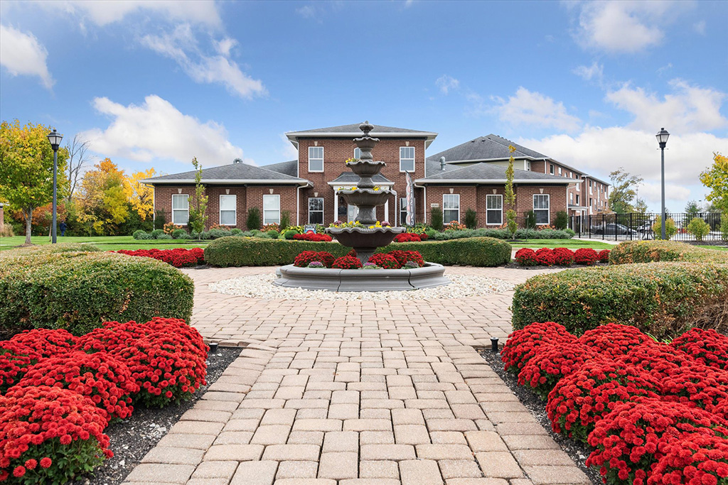 Photo of the beautiful fountain and landscaping in front of the front office at the Towne Park property in Troy, Ohio.